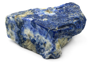 Natural rough lapis lazuli stone on a white background.